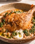 close up of one-Pan Crispy Chicken with Cannellini Beans and Pistachio Pesto