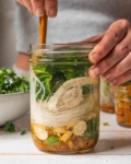 stirring meal prep soup jars